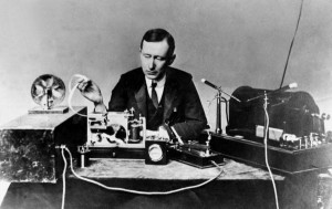 Electrical engineer/inventor Guglielmo Marconi operating apparatus similar to that used by him to transmit first wireless signal across Atlantic. Via Wikipedia.