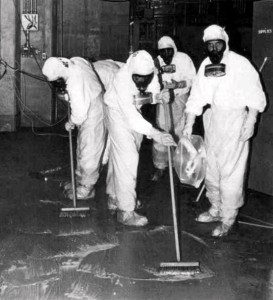A clean-up crew working to remove radioactive contamination at Three Mile Island. Via Wikipedia.