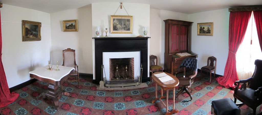 Panoramic image of the reconstructed parlor of the McLean House. Ulysses S. Grant sat at the simple wooden table on the right, while Robert E. Lee sat at the more ornate marble-topped table on the left. Via Wikipedia.