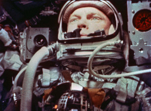 A camera aboard the "Friendship 7" Mercury spacecraft photographs Astronaut John H. Glenn Jr. during the Mercury-Atlas 6 spaceflight (00302-3); Photographs Glenn as he uses a photometer to view the sun during sunset on the MA-6 space flight (00304).
